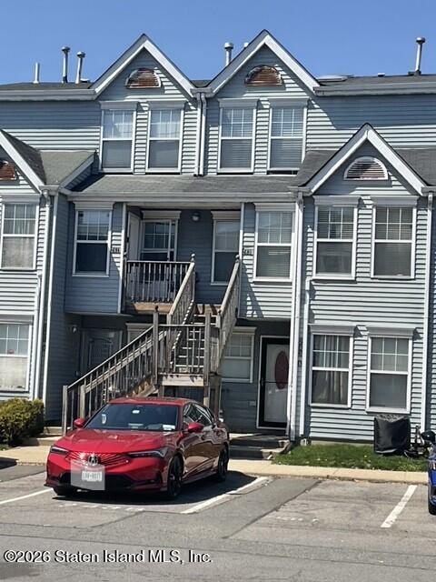 243 Pond Way, Unit B Staten Island, NY 10303 - Photo 1 of 10 a front view of a house with a yard