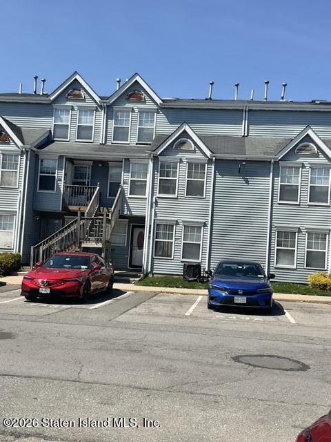 243 Pond Way, Unit B Staten Island, NY 10303 - Photo 2 of 10 a front view of a house with parking