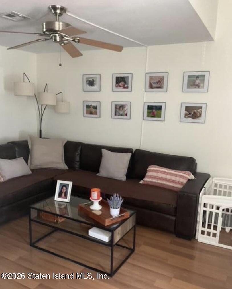 243 Pond Way, Unit B Staten Island, NY 10303 - Photo 6 of 10 a living room with furniture