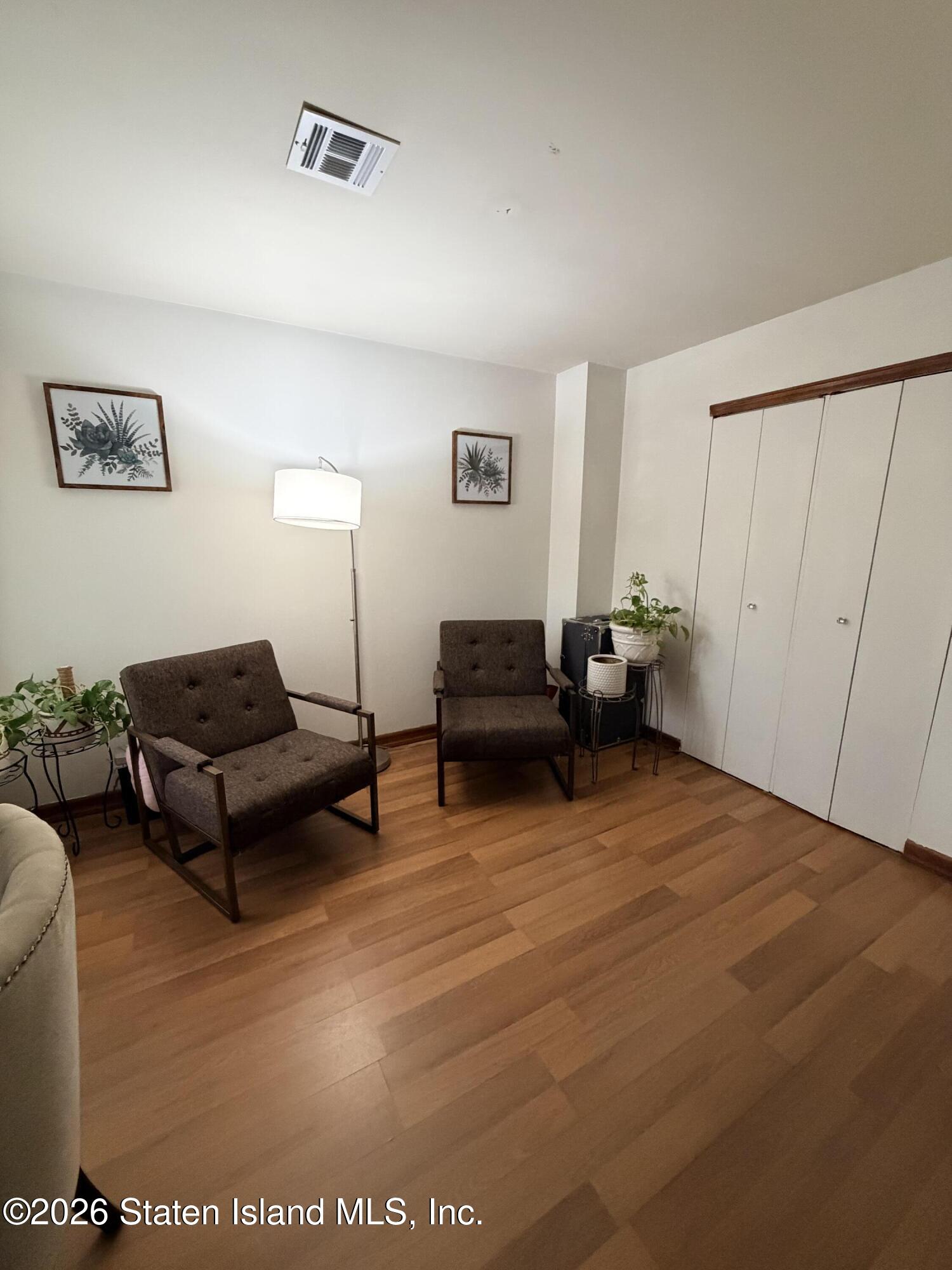 243 Pond Way, Unit B Staten Island, NY 10303 - Photo 8 of 10 a living room with furniture