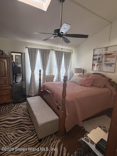 243 Pond Way, Unit B Staten Island, NY 10303 - Photo 10 of 10 a bedroom with a large bed and a window