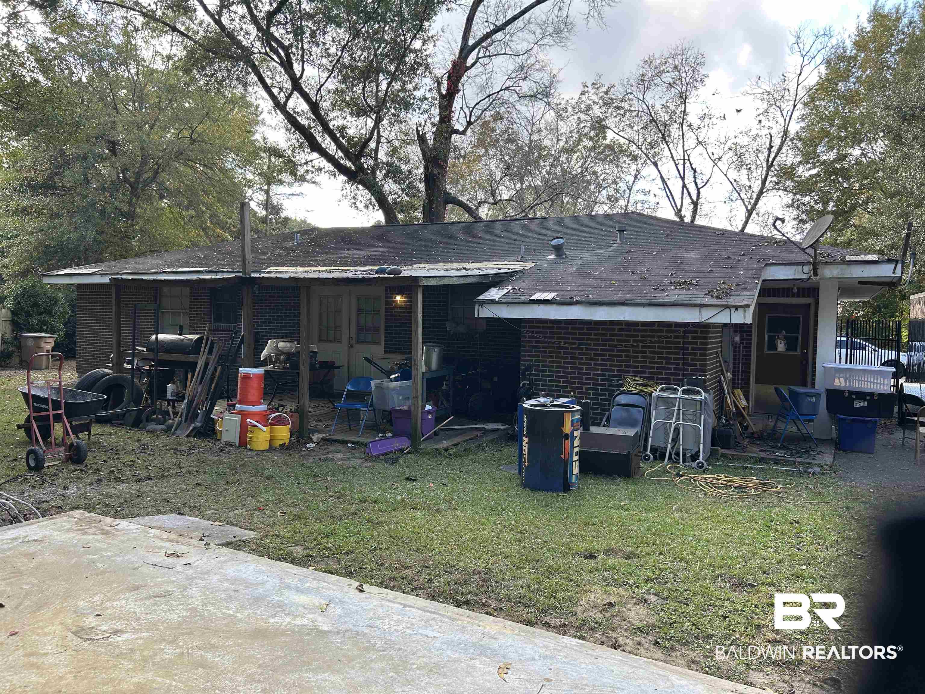 1600 Decatur Street Mobile, AL 36618 - Photo 4 of 5 Back of house with a patio, a lawn, and brick siding