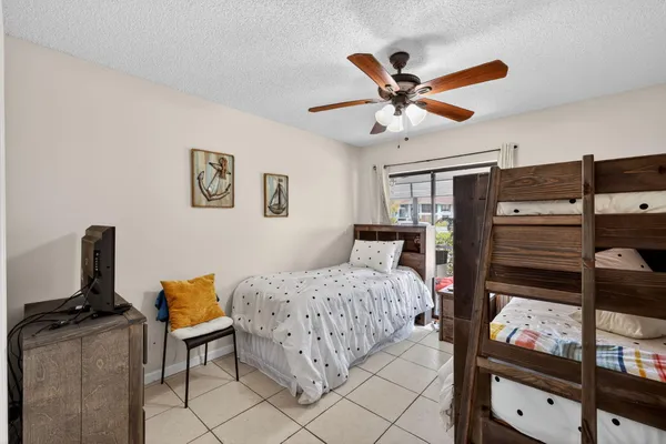 a bedroom with a bed and dresser