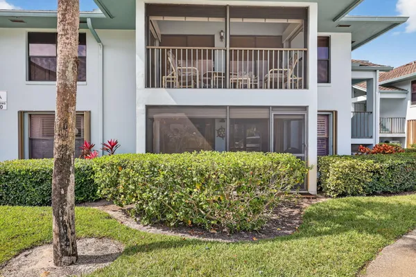 a front view of building with yard