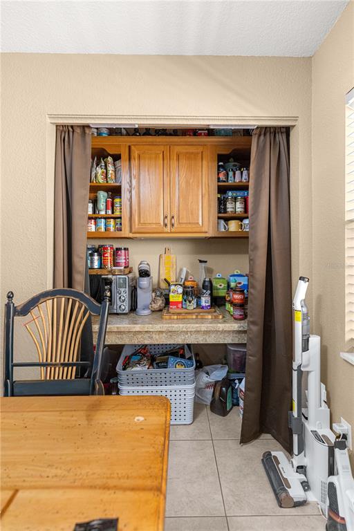 2837 Northeast 3rd Street, Unit 203 Ocala, FL 34470 - Photo 11 of 41 a living room with furniture and a book shelf