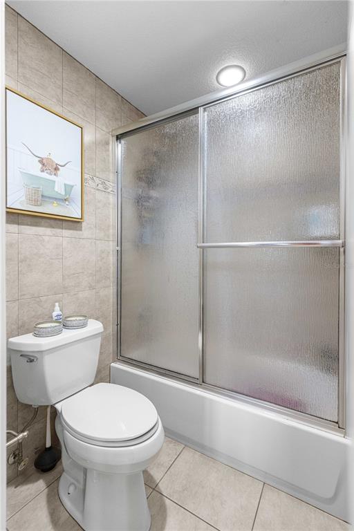 2837 Northeast 3rd Street, Unit 203 Ocala, FL 34470 - Photo 22 of 41 a bathroom with a toilet sink and shower