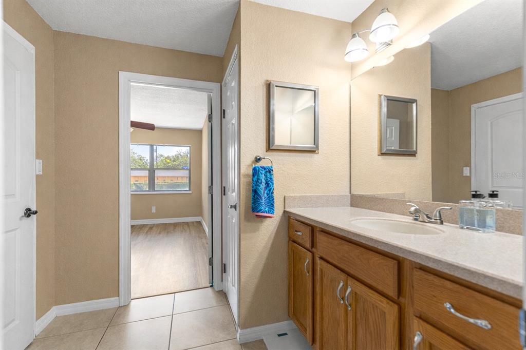2837 Northeast 3rd Street, Unit 203 Ocala, FL 34470 - Photo 25 of 41 a bathroom with a sink and a mirror
