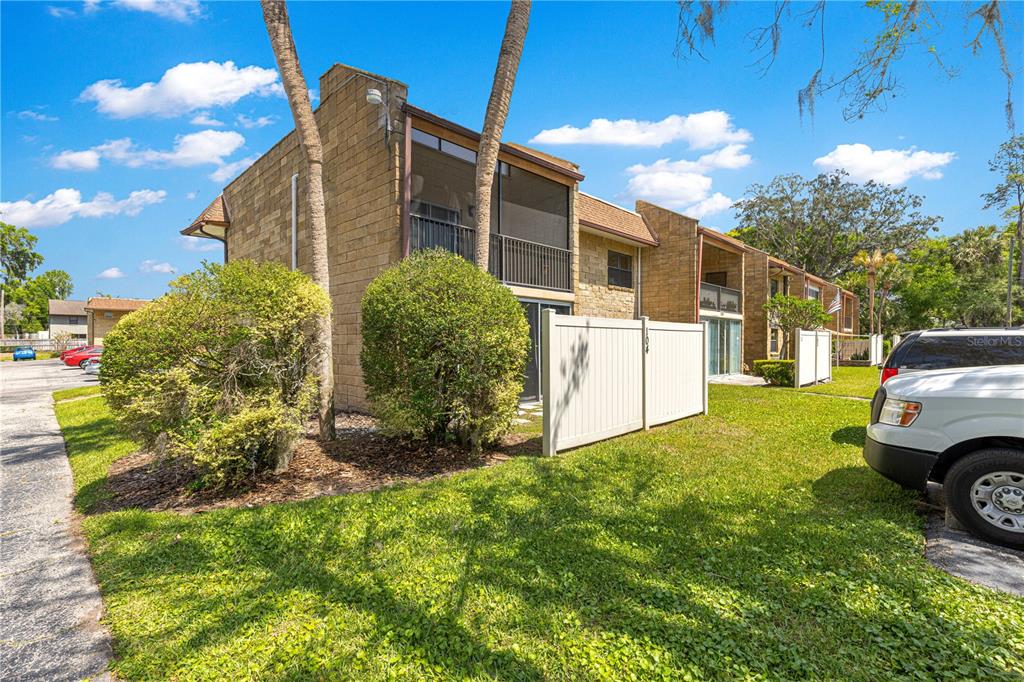 2837 Northeast 3rd Street, Unit 203 Ocala, FL 34470 - Photo 31 of 41 a view of a house with a back yard