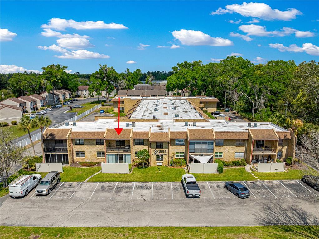 2837 Northeast 3rd Street, Unit 203 Ocala, FL 34470 - Photo 34 of 41 a aerial view of a house with a yard