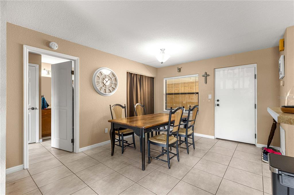2837 Northeast 3rd Street, Unit 203 Ocala, FL 34470 - Photo 7 of 41 a view of a dining area with furniture and a large window