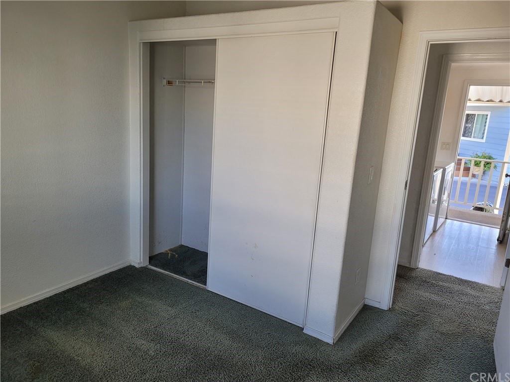 32 Walnut Via Anaheim, CA 92801 - Photo 13 of 24 a view of a hallway with wooden floor and closet
