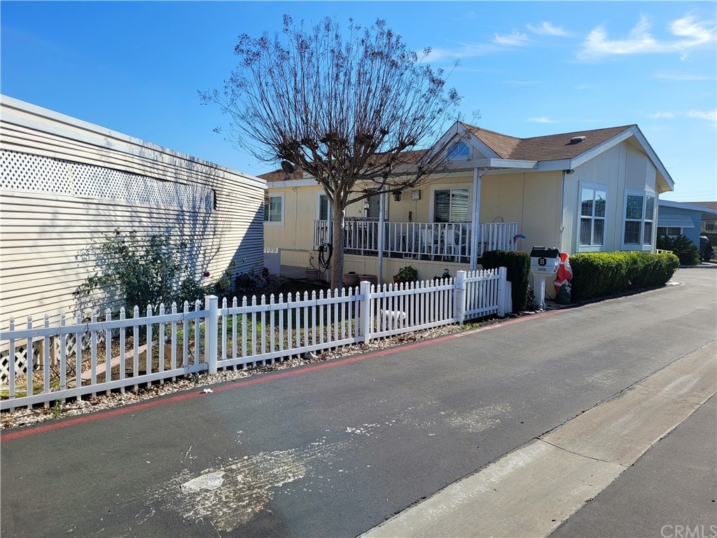 32 Walnut Via Anaheim, CA 92801 - Photo 3 of 24 a front view of a house with a yard
