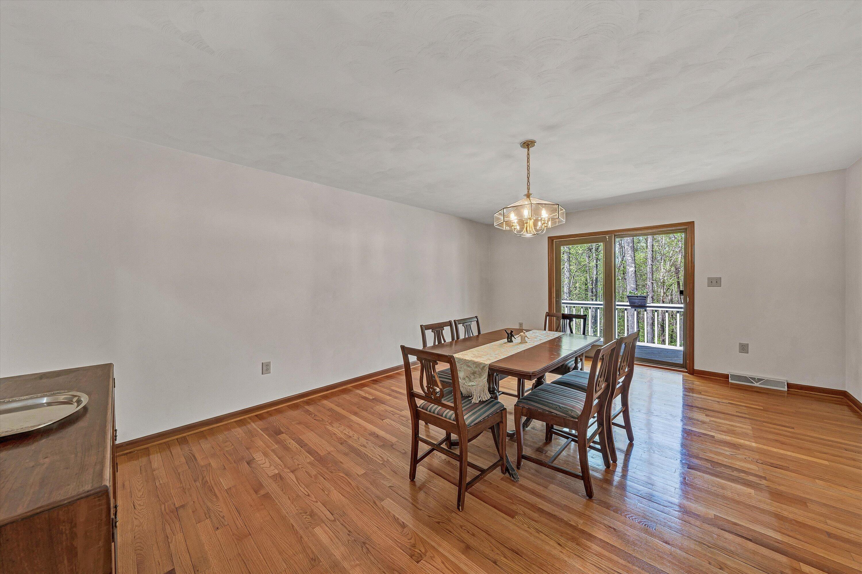 1124 Old Hollow Road Buchanan, VA 24066 - Photo 16 of 73 a view of a dining room with furniture window and wooden floor