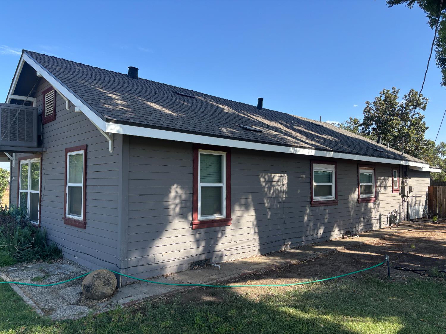 19317 East Parlier Avenue Reedley, CA 93654 - Photo 15 of 36 a front view of a house with garden
