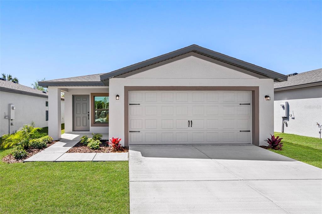 229 Galaxy Avenue Spring Hill, FL 34606 - Photo 1 of 9 a front view of house with yard
