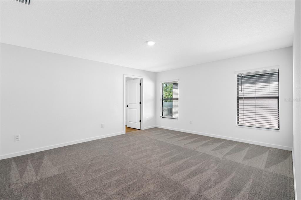 229 Galaxy Avenue Spring Hill, FL 34606 - Photo 6 of 9 an empty room with windows
