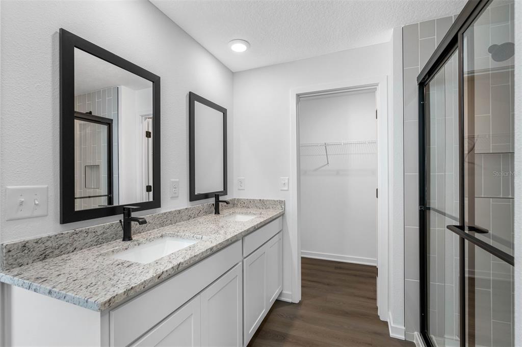 229 Galaxy Avenue Spring Hill, FL 34606 - Photo 9 of 9 a bathroom with a granite countertop sink and a mirror