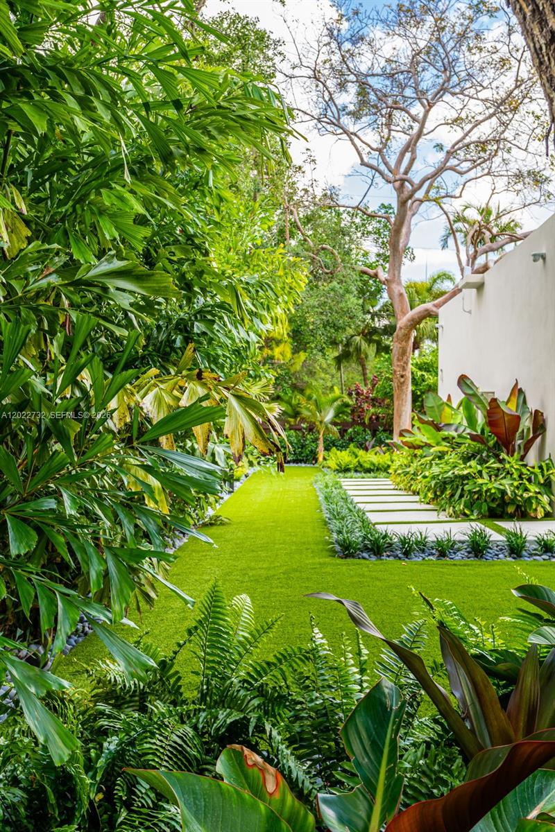7825 Southwest 128th Street Pinecrest, FL 33156 - Photo 62 of 88 a view of a garden with a tree