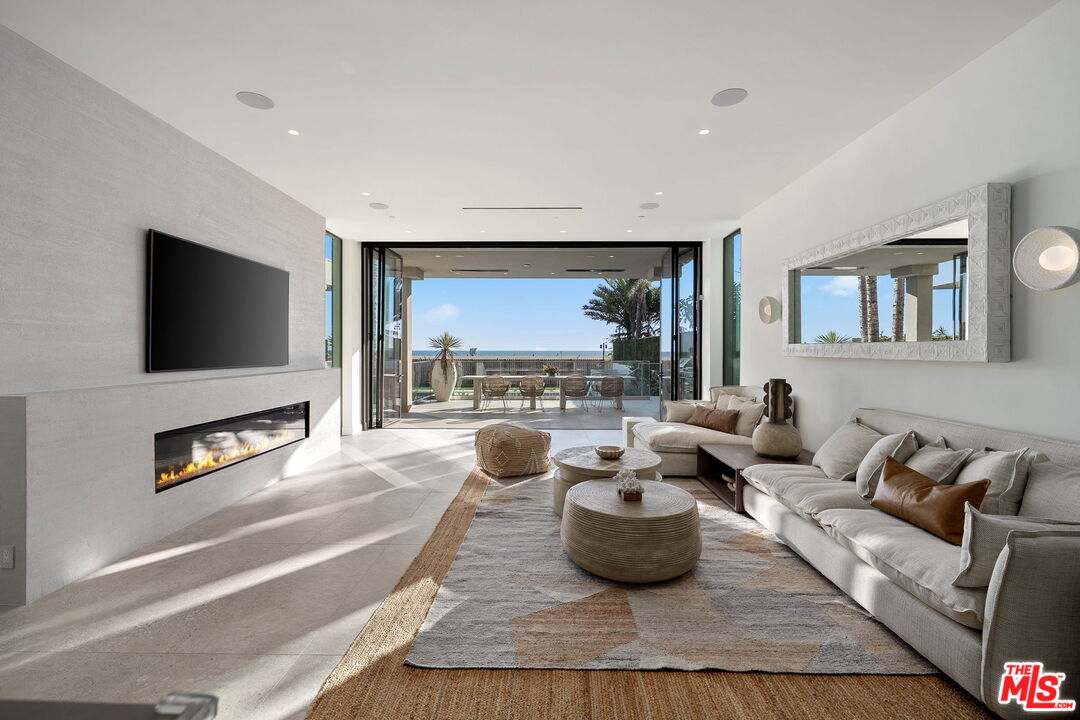 938-940 Palisades Beach Road Santa Monica, CA 90403 - Photo 52 of 72 a living room with furniture and a flat screen tv