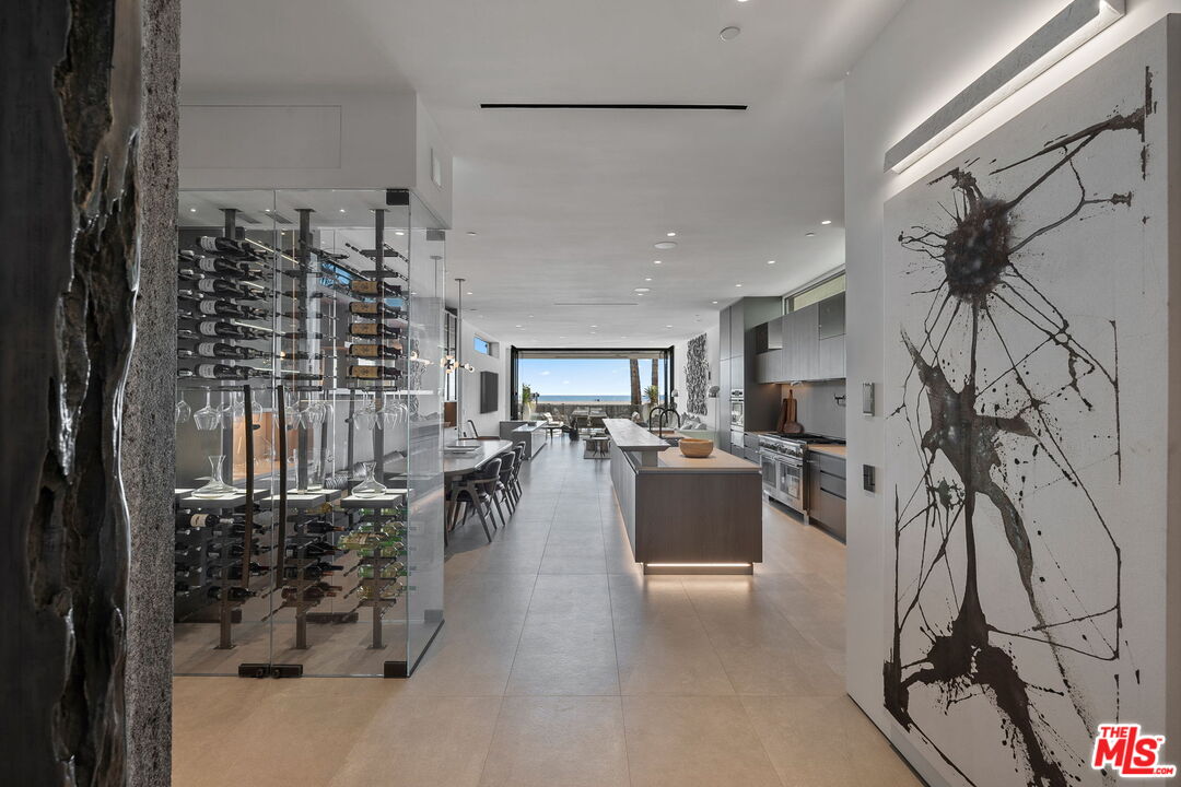 938-940 Palisades Beach Road Santa Monica, CA 90403 - Photo 8 of 72 a dining room with furniture and a floor to ceiling window