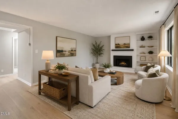a living room with furniture and a fireplace