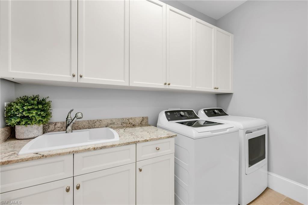 2306 Tradition Way, Unit 102 Naples, FL 34105 - Photo 20 of 39 Laundry room with granite countertops and brand new General Electric washer/dryer units.