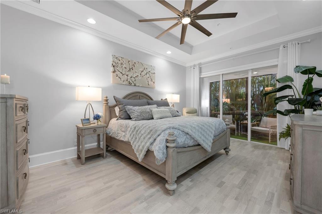 2306 Tradition Way, Unit 102 Naples, FL 34105 - Photo 8 of 39 Spacious Primary Suite with cozy lanai.