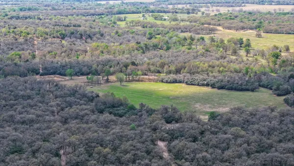 a view of a field with an outdoor space
