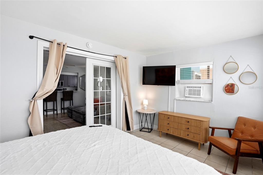2311 Bay Boulevard Indian Rocks Beach, FL 33785 - Photo 33 of 80 a bedroom with a bed and a flat screen tv