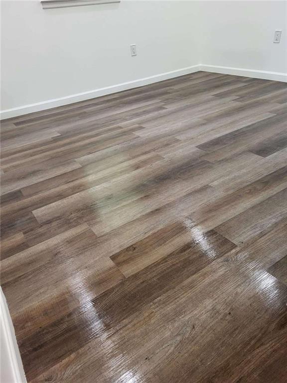 389 Collins Road Toccoa, GA 30577 - Photo 5 of 15 a view of a room with wooden floor