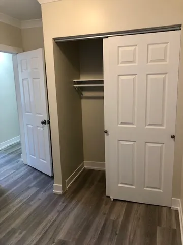 an empty room with wooden floor