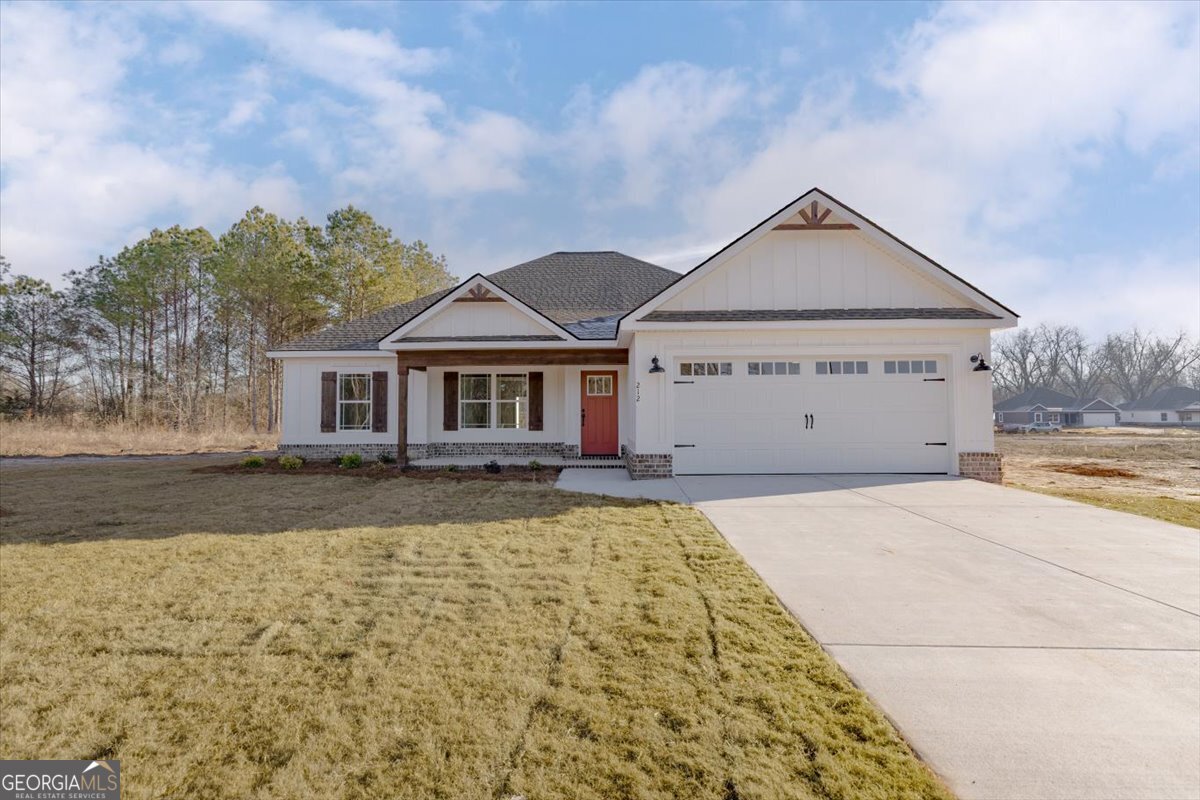 front view of a house with a yard