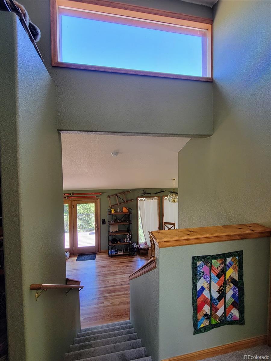 33348 Persistence Avenue Pine, CO 80470 - Photo 13 of 40 a view of dining room with wooden floor