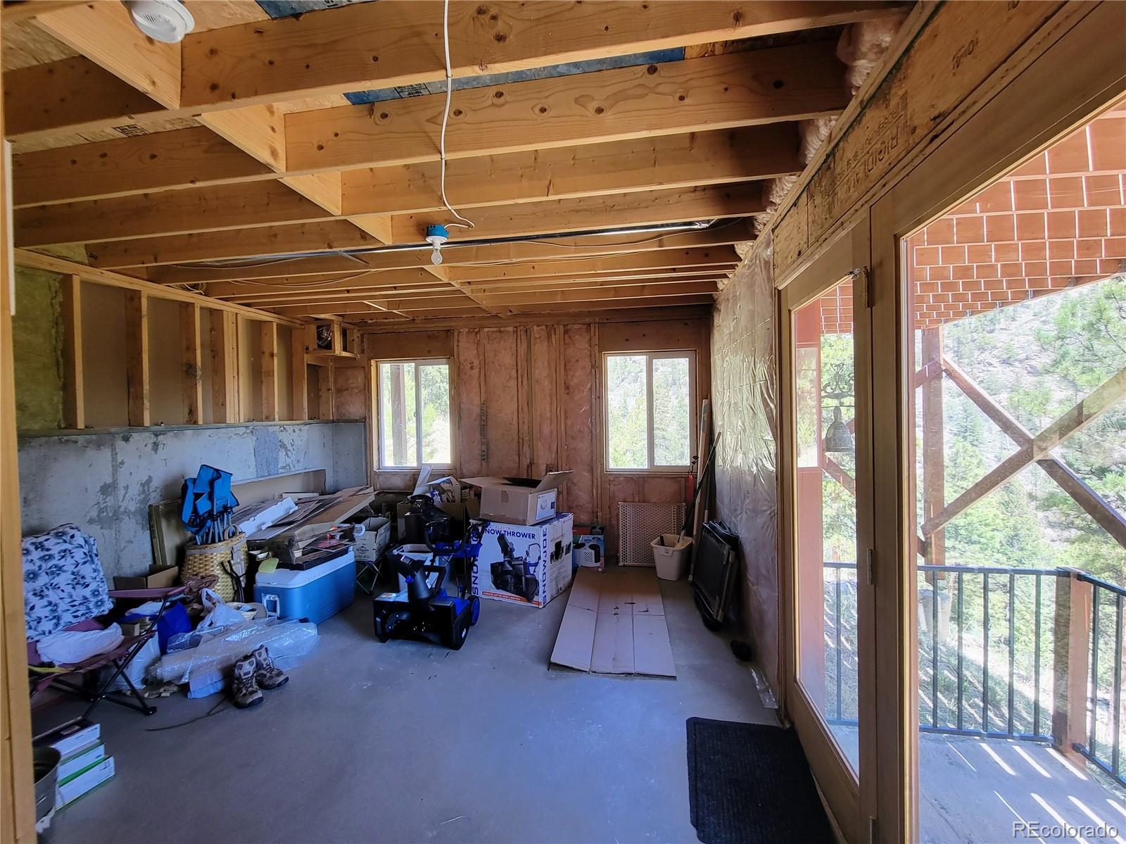 33348 Persistence Avenue Pine, CO 80470 - Photo 25 of 40 a living room with lots of furniture and a windows