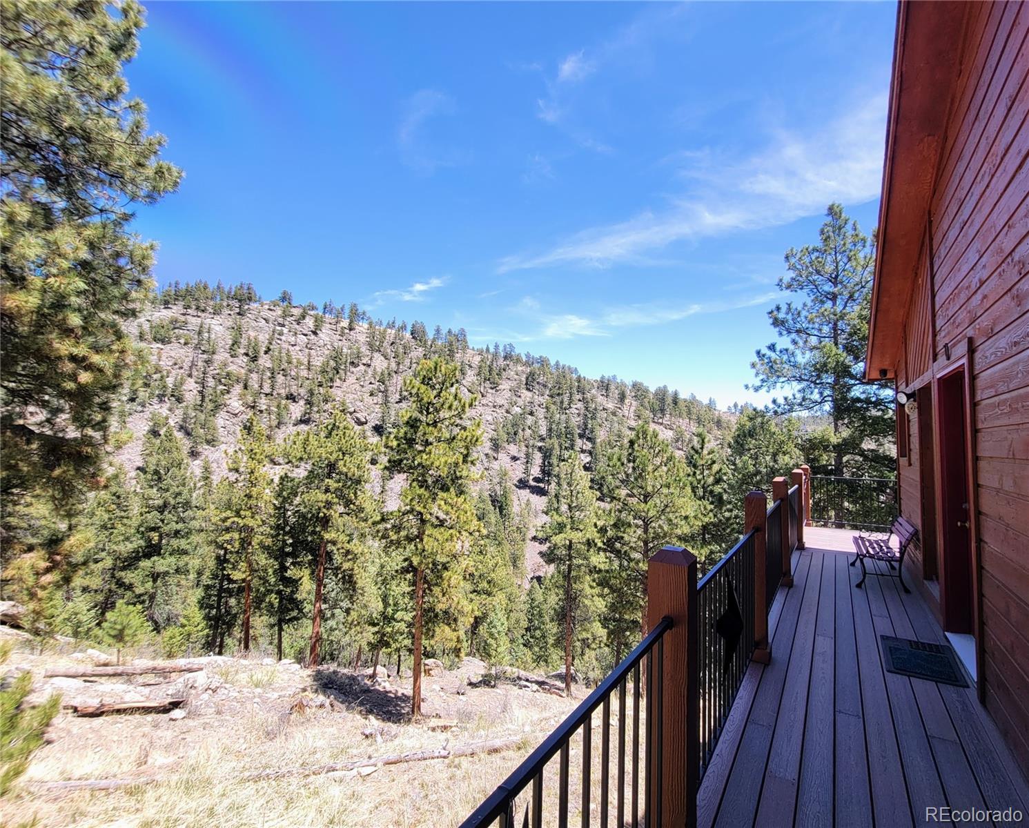 33348 Persistence Avenue Pine, CO 80470 - Photo 28 of 40 a view of a balcony with an outdoor space