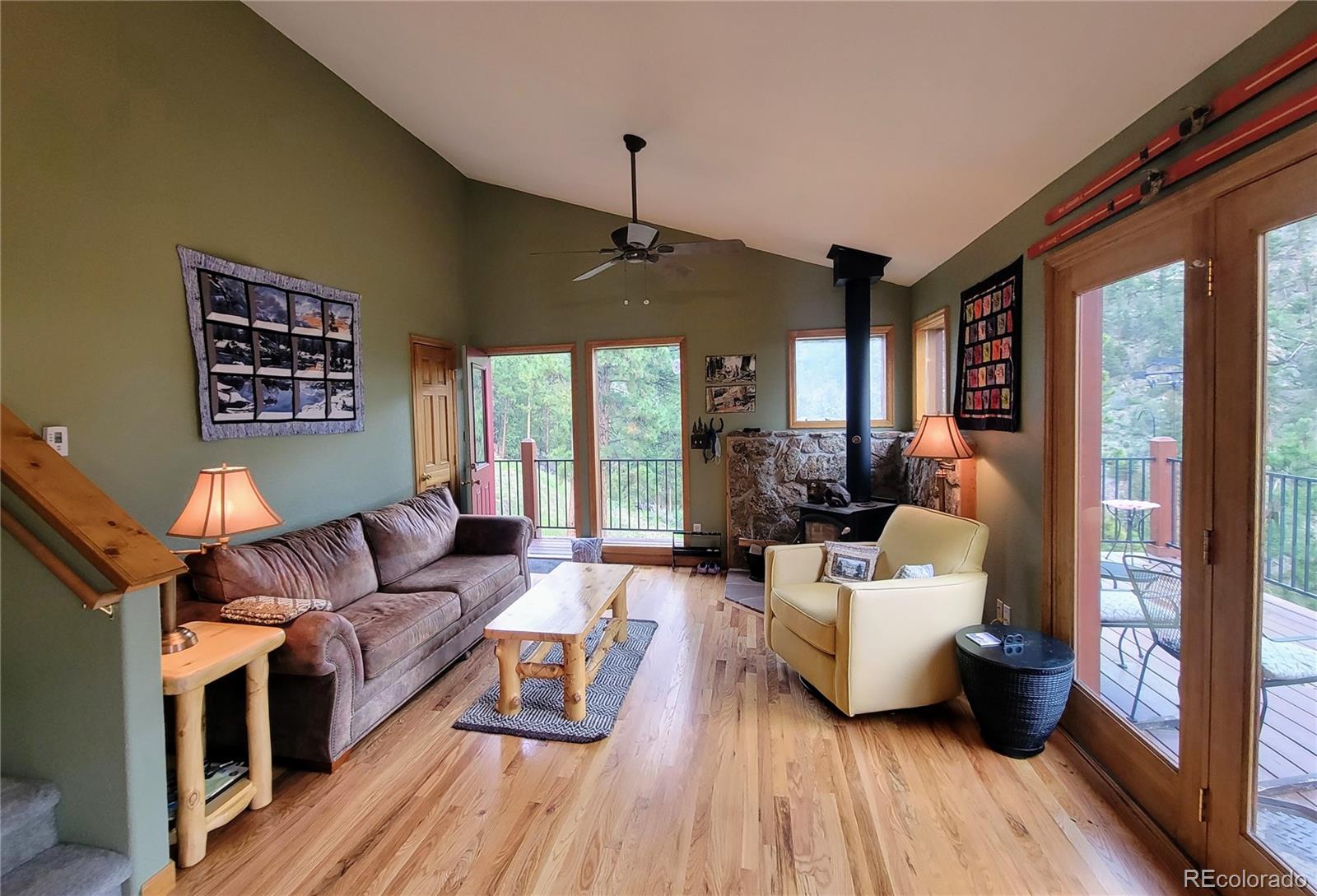 33348 Persistence Avenue Pine, CO 80470 - Photo 6 of 40 a living room with furniture and a wooden floor