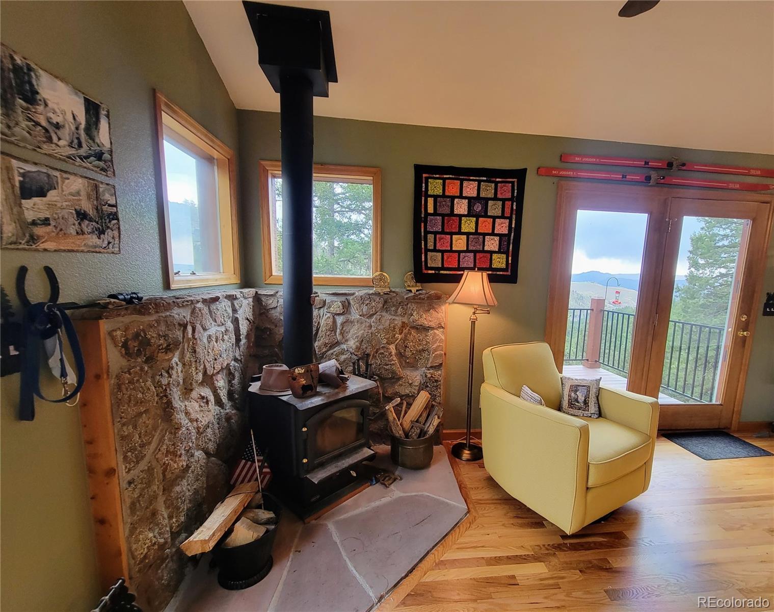 33348 Persistence Avenue Pine, CO 80470 - Photo 7 of 40 a living room with furniture and floor to ceiling windows