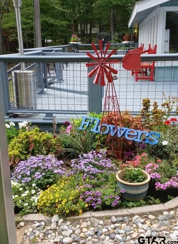 a view of a backyard with sitting area