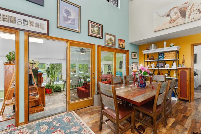 a view of a workspace with furniture and a potted plant