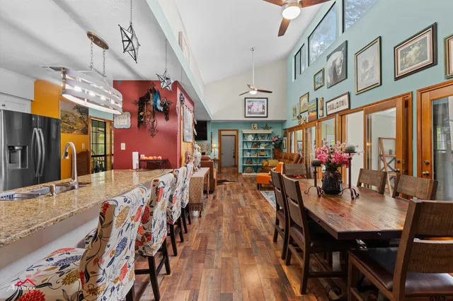 a view of a dining area with furniture and chandelier