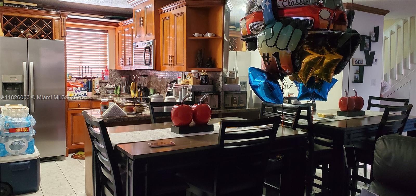 8085 Northwest 8th Street, Unit 6 Miami, FL 33126 - Photo 1 of 15 a view of a kitchen with appliances and cabinets