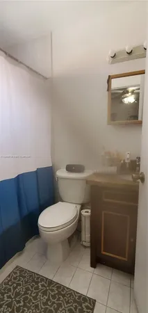 a bathroom with a toilet and a sink