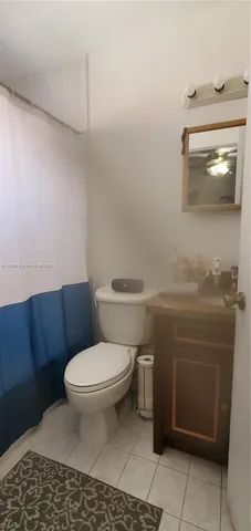 a bathroom with a toilet and a sink