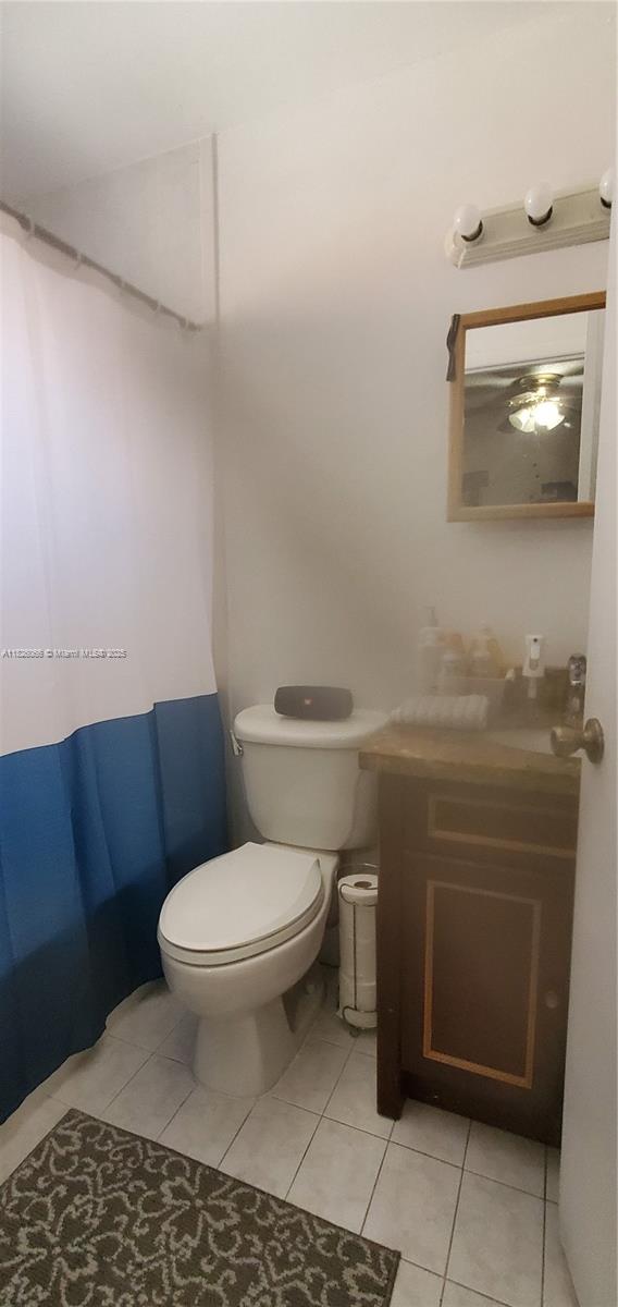 8085 Northwest 8th Street, Unit 6 Miami, FL 33126 - Photo 11 of 15 a bathroom with a toilet and a sink