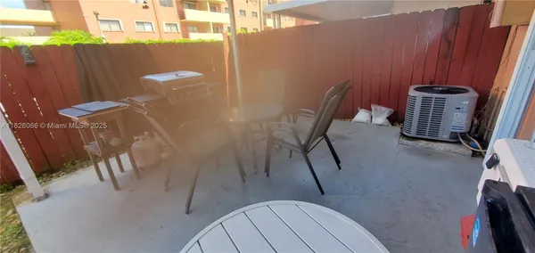 a view of a dining room with furniture and a rug