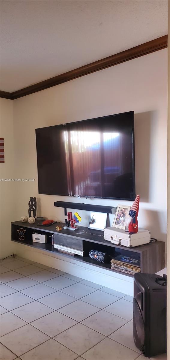 8085 Northwest 8th Street, Unit 6 Miami, FL 33126 - Photo 3 of 15 a living room with furniture and a flat screen tv