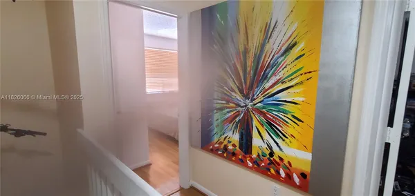 a view of a hallway with windows