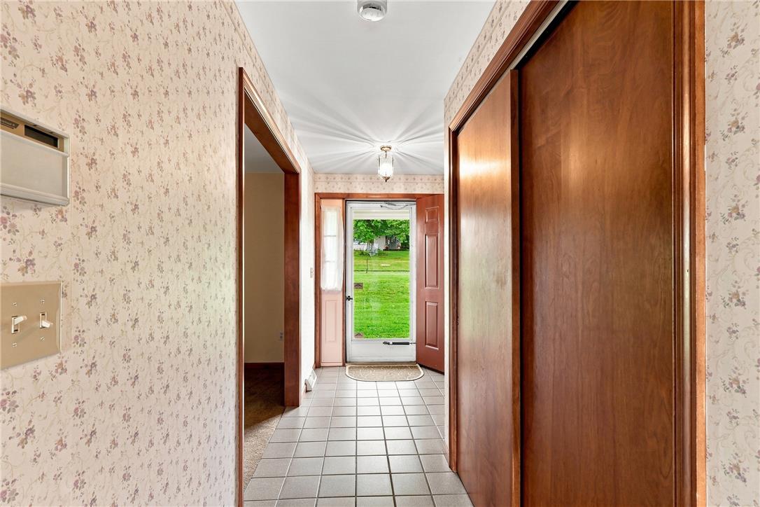 6090 Stone Post Road Bath, PA 18014 - Photo 8 of 57 A welcoming entryway leads to a well-lit interior, perfect for greeting guests.