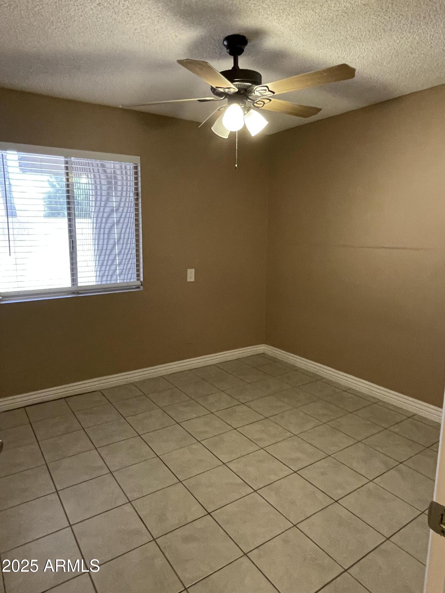 732 West Rice Drive Tempe, AZ 85283 - Photo 11 of 18 an empty room with windows