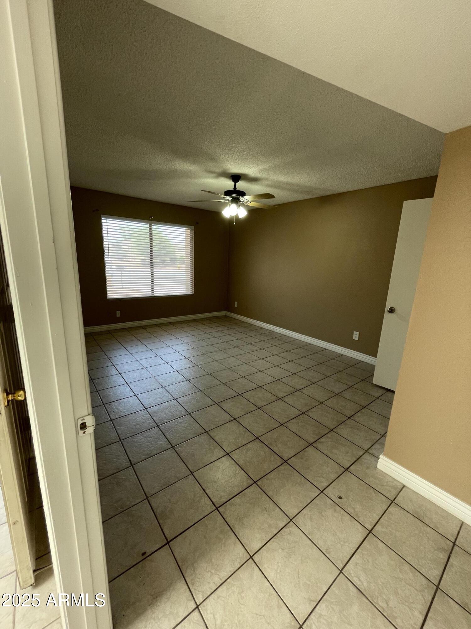732 West Rice Drive Tempe, AZ 85283 - Photo 15 of 18 a view of an empty room and a window